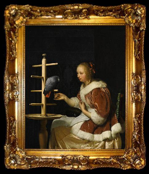 framed  Frans van Mieris A Young Woman in a Red Jacket Feeding a Parrot, ta009-2